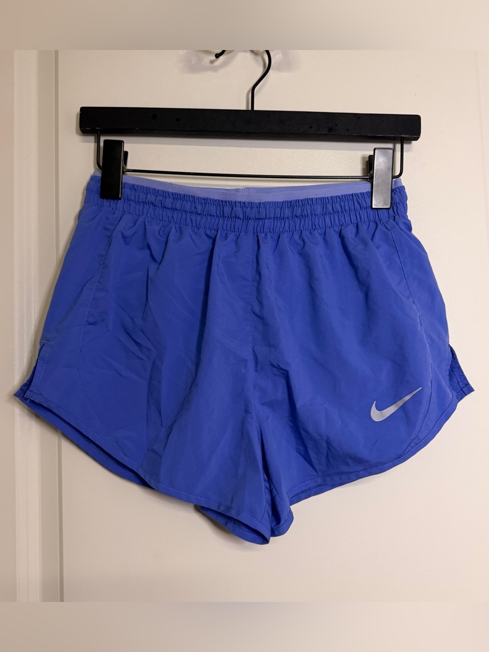 Nike Women's Athletic Shorts in Vibrant Purple with Reflective Swoosh